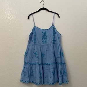 light blue embroidered dress with adjustable straps; above knee length
